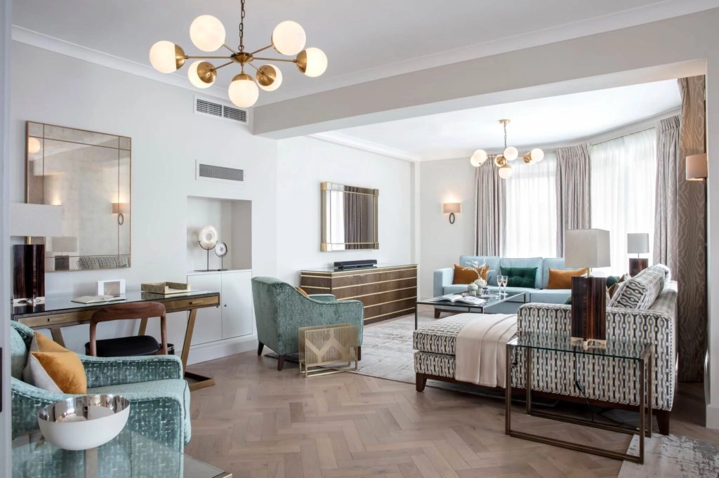 Elegant Arlington House lounge with plush sofas, stylish decor, large windows, and modern furnishings for a luxurious stay.